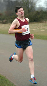 Running in an antique vest Richard Ward goes through the pain barrier and at the half way stage we were in 6th place.